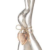 Prodotto Coniglio decorativo in argento su base in legno – Elegante figura pasquale con ciondolo a forma di cuore H60cm