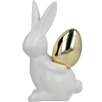 Prodotto Conigli con uovo d'oro, conigli in ceramica per Pasqua bianco nobile, dorato H13cm 2pz