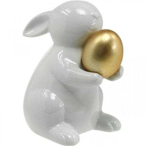 Floristik24 Coniglio con uovo dorato in ceramica, decoro pasquale bianco elegante, dorato H15cm
