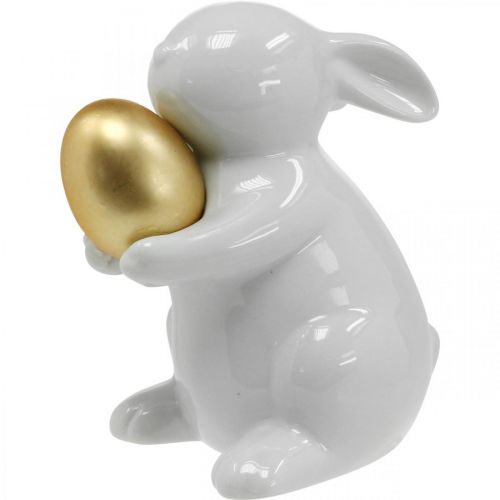 Floristik24 Coniglio con uovo dorato in ceramica, decoro pasquale bianco elegante, dorato H15cm