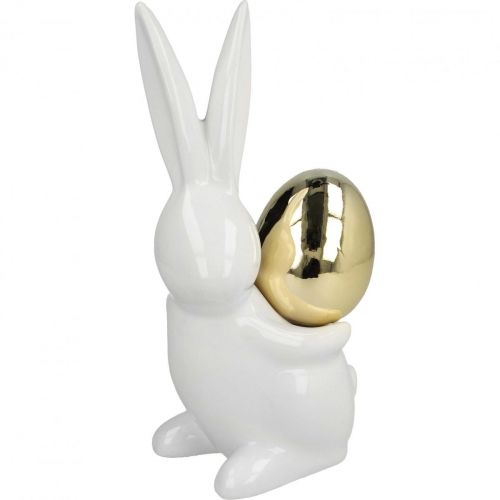 Floristik24 Coniglietti pasquali eleganti, coniglietti in ceramica con uovo oro, decoro pasquale bianco, dorato H18cm 2pz