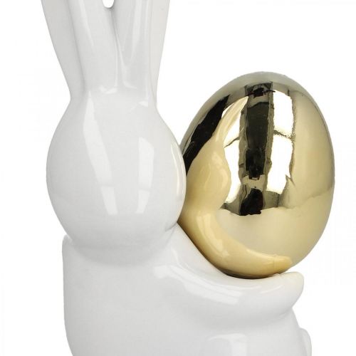 Floristik24 Coniglietti pasquali eleganti, coniglietti in ceramica con uovo d&#39;oro, decorazione pasquale bianca, dorata H18cm 2 pezzi