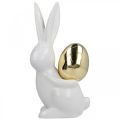 Floristik24 Coniglietti pasquali eleganti, coniglietti in ceramica con uovo oro, decoro pasquale bianco, dorato H18cm 2pz